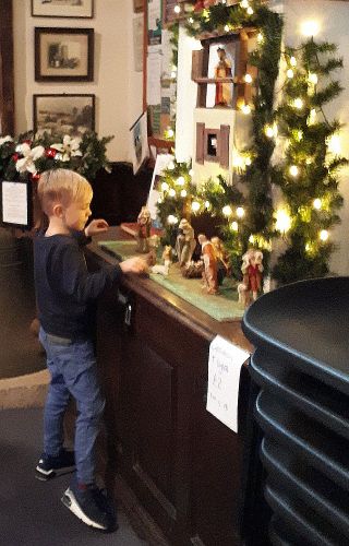 Ryan arranging the Nativity Scene at Messy Nativity 19/12/2021